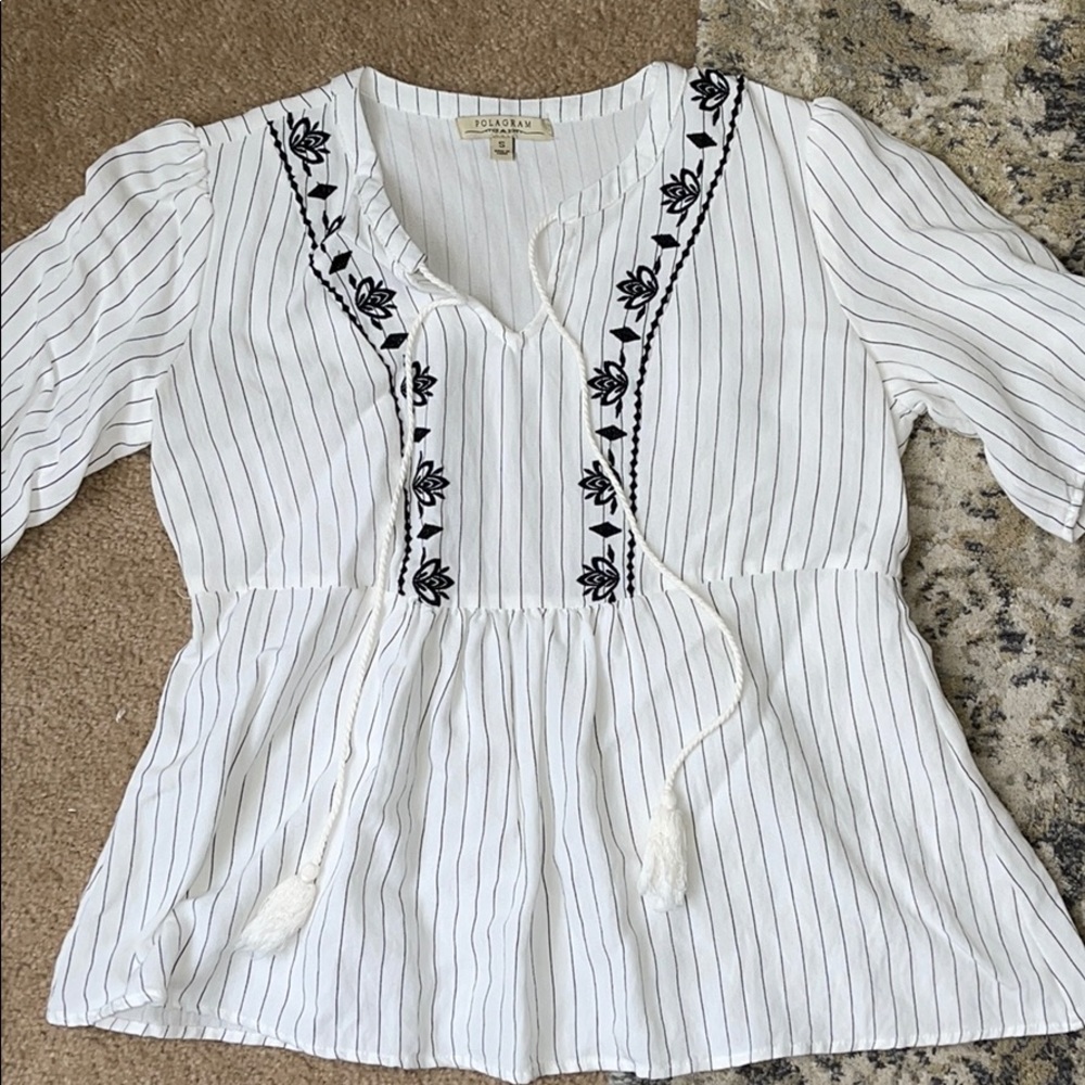 White blouse with tassels